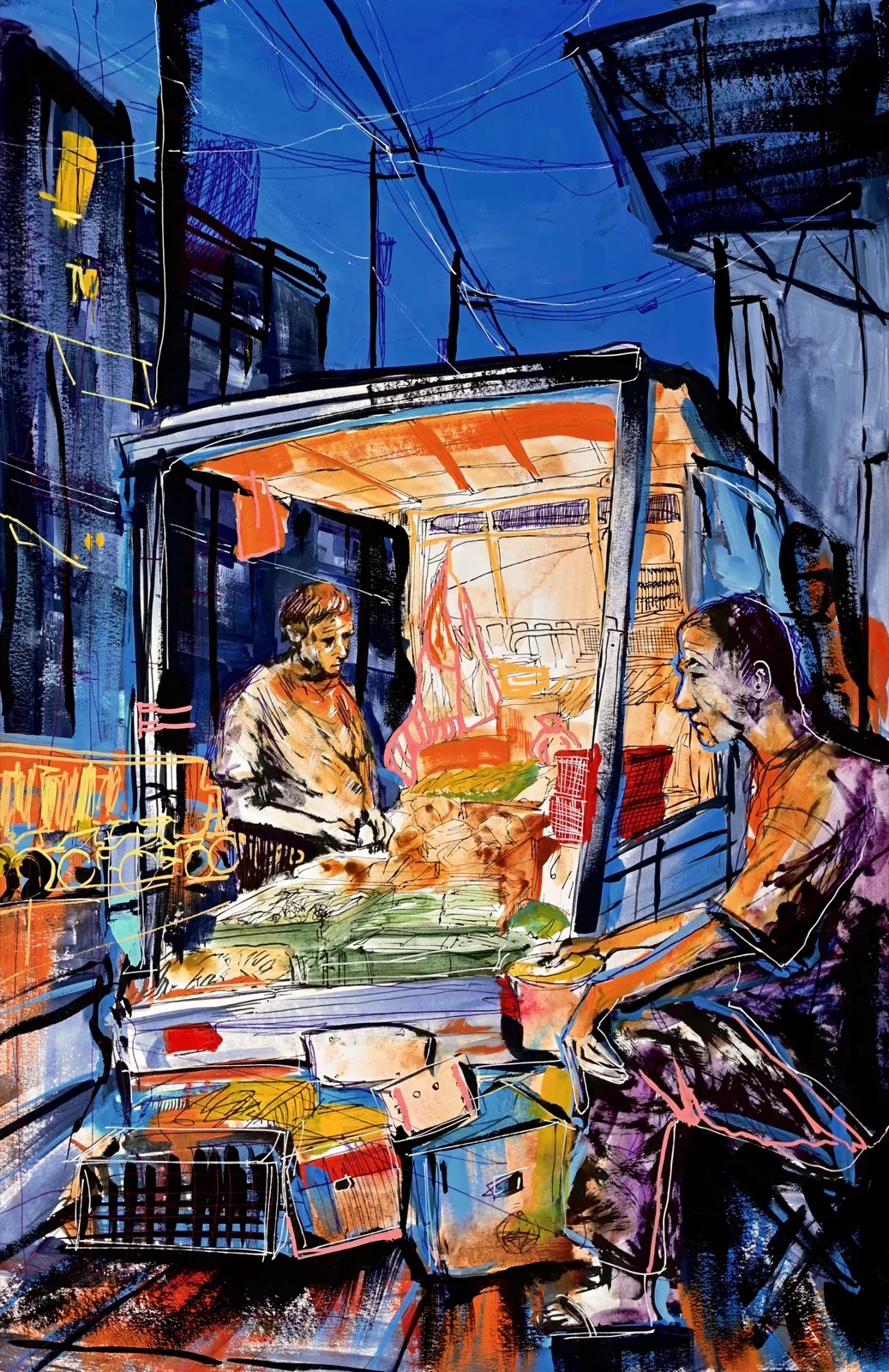 Two vendors working beside a brightly lit produce stall on a dark blue street